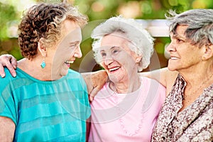 Theyre like sisters. Shot of a group of smiling senior women standing outside.