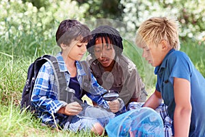 Theyre ready to go on their journey. Three little boys spending time outdoors together.