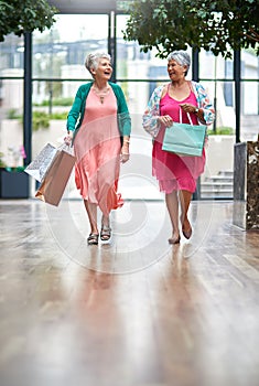 Theyre ready to spend big. Full length shot of a two senior women out on a shopping spree.