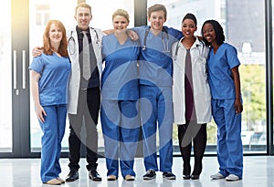 Theyre some of the finest medical professionals around. Portrait of a group of medical practitioners standing together
