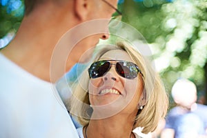 Theyre still young at heart. an affectionate mature couple at an outdoor festival.