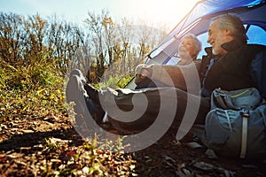 Theyre two happy campers. a senior couple camping together in the wilderness.