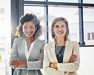 Theyre the two standouts in business. Portrait of two confident young businesswomen standing together in an office.