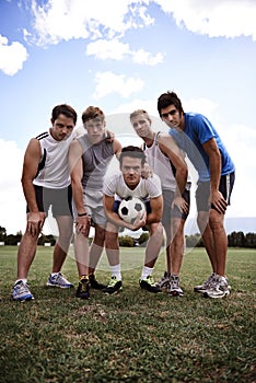 Theyre in it for the win. Portrait of a group of determined young soccer players.