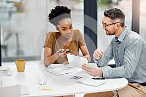 Theyre a winning team. two businesspeople working together in their office.