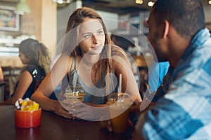 Theyve got loads to catch up on. Cropped shot of a young couple on a date in a cafe.