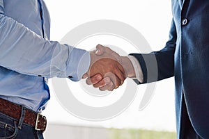 Theyve reached an agreement. Closeup shot of two businessmen shaking hands in an office.