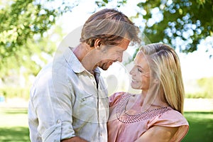 Theyve still got great chemistry together. an affectionate mature couple enjoying a day in the park.