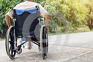 Theâ€‹ Asian senior or elderly old lady woman patient on wheelchair at the front house,healthy strong medical concept