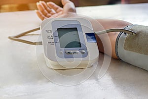 Theâ€‹ People are check blood pressure monitor and heart rate monitor with digital pressure. Healthcare and Medical concept