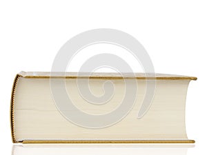 Thick book with gold cover isolated on white background.