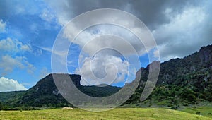 Thick clouds in between hills of Mundo Perdido, Timor-Leste