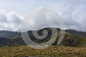 Thick Clouds Hovering Over the Fell Summit photo