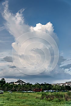 A thick cumulonimbus cloud that is raining