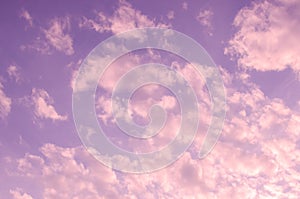 Thick fluffy pink sunset clouds background