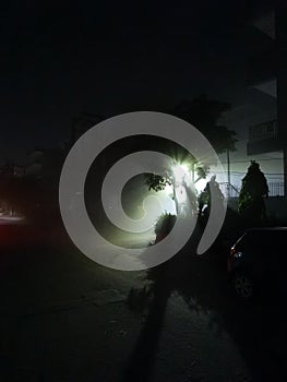 A thick fog caused by the sand storm on the streets of Delhi