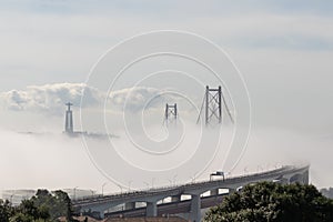 Thick fog envelops the bridge - people run a marathon on the bridge