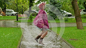 Thick girl jumping in a puddle