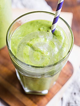 Thick green vegan smoothie in a glass