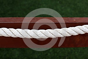 Thick hemp rope on the pier in the seaport.