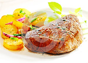 Thick juicy steak with crisp roast potatoes