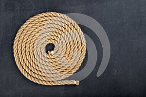 Thick jute rope coiled in the shape of a circle. Sailing accessories used on yachts