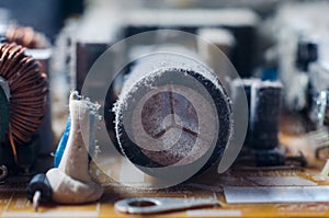 A thick layer of dust covers the internal electronic components of the computer