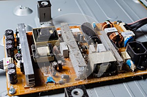 A thick layer of dust covers the internal electronic components of the computer