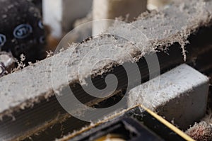 A thick layer of dust covers the internal electronic components of the computer
