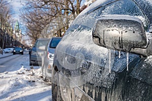 Thick layer of ice on car after freezing rain