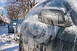 Thick layer of ice covering car