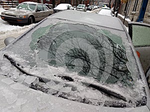 Thick layer of ice covering car