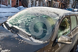 Thick layer of ice covering car