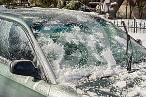 Thick layer of ice covering car