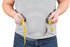 Thick mature man measuring belly yellow measuring tape isolated