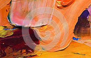 Thick oil paint. Close up view of volumetric brushstrokes of colorful paints. abstract artwork. Paint facture on canvas.