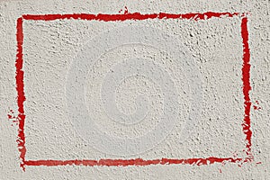 Thick red graffiti painted frame border on whitewashed concrete wall with copy space for writing - horizontal