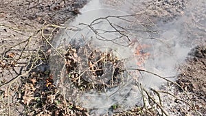 Thick smoke and large flames from the slowmo fire, bonfire flares up