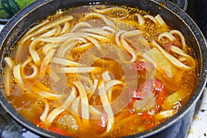 Thick soup with noodles lagman with sweet pepper and lamb