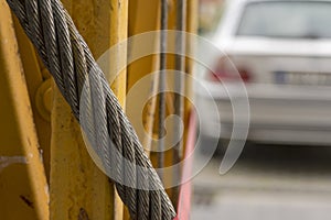 A thick steel rope braided in a braid of many steel fibers.