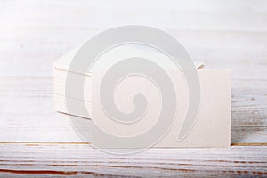Thick white cotton paper business card mock up on vintage wooden deck