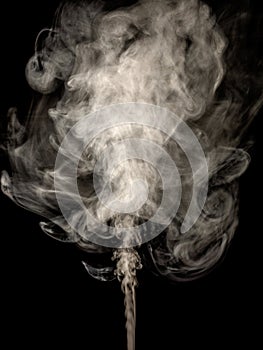 Thick white smoke isolated on a black, rising tubers upwards as an abstract effect