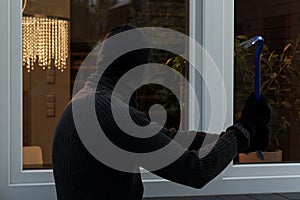 Thief breaks the glass