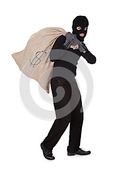 Thief carrying a large bag of money