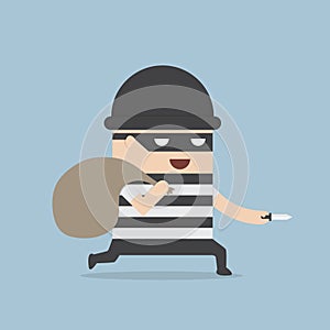 Thief cartoon holding knife in his hand and carrying a money bag