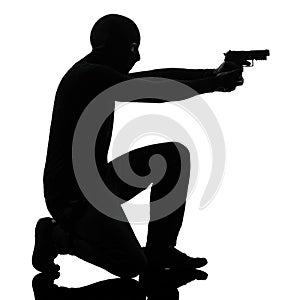 Thief criminal terrorist aiming gun man photo