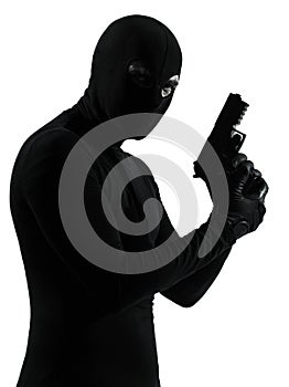 Thief criminal terrorist holding gun portrait