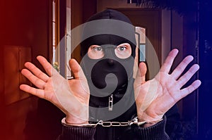 Thief in handcuffs - police arrested him