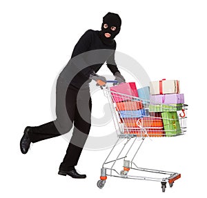Thief pushing a trolley of gifts