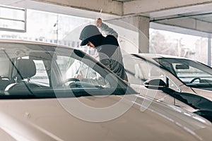 Thief robbing a car photo